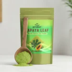 Close-up of a wooden scoop overflowing with fine green ACTIZEET papaya leaf powder
