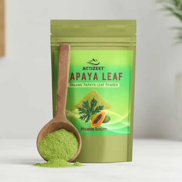 Close-up of a wooden scoop overflowing with fine green ACTIZEET papaya leaf powder