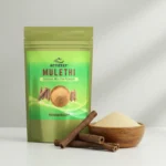 Fine yellow ACTIZEET Mulethi powder next to raw licorice sticks