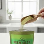 Wooden scoop overflowing with ACTIZEET Neem Giloy herbal powder