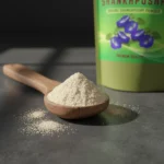 shankhpushpi-powder-texture-wooden-spoon